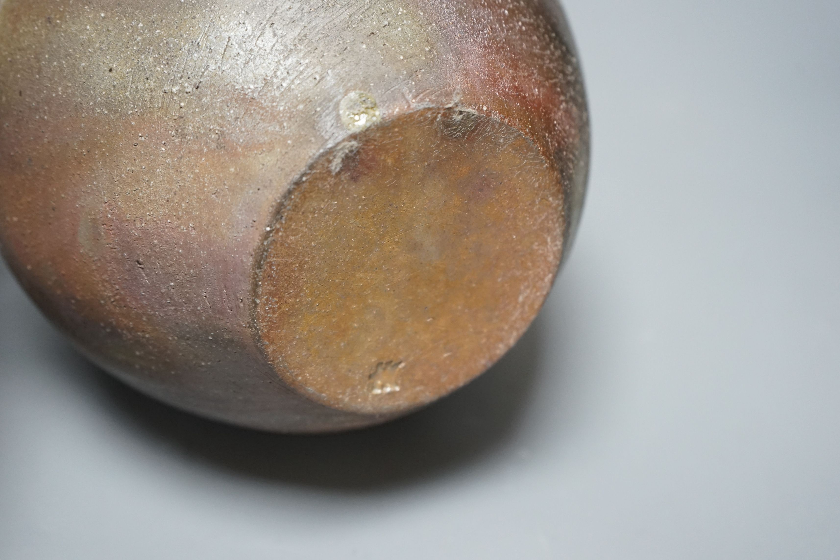 Japanese studio pottery: a boxed black glaze stoneware unomi tea bowl, with impressed mark, together with a ovoid vase, marked, 21cm tall